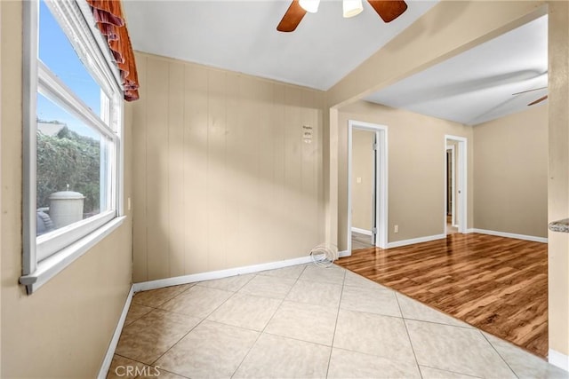 unfurnished room featuring light tile patterned flooring