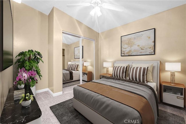 carpeted bedroom featuring a closet and ceiling fan