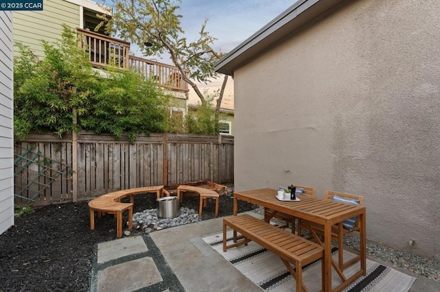 view of patio terrace at dusk