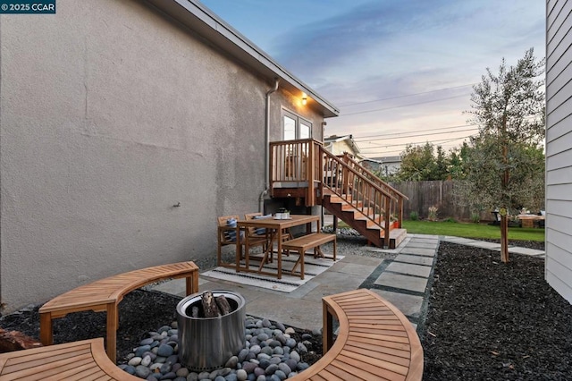 patio terrace at dusk with a yard