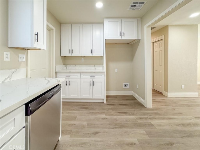 kitchen featuring white cabinets, dishwasher, light stone counters, and light hardwood / wood-style flooring