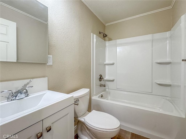 full bathroom with ornamental molding, vanity, shower / washtub combination, hardwood / wood-style flooring, and toilet