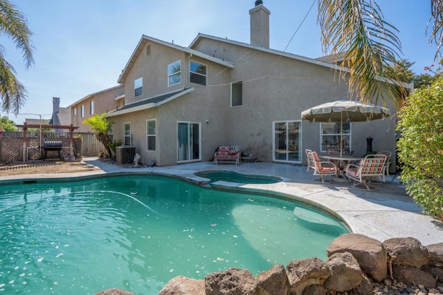 view of pool with central AC unit, a patio area, and area for grilling