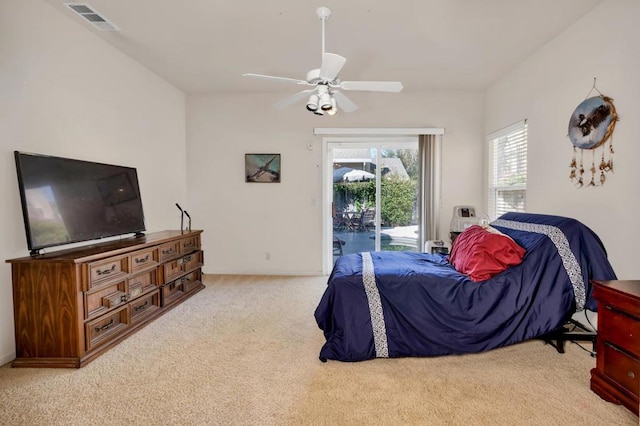 carpeted bedroom with access to outside and ceiling fan