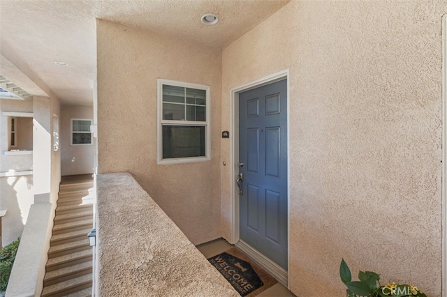 doorway to property featuring a balcony