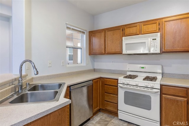 kitchen with sink and white appliances