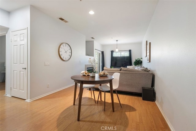 living room with light hardwood / wood-style flooring