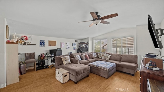 living room featuring light hardwood / wood-style floors, ceiling fan, and vaulted ceiling