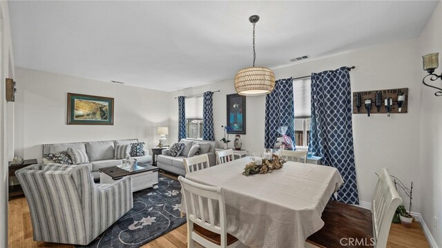 dining space featuring hardwood / wood-style floors