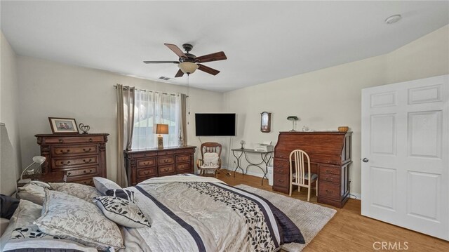 bedroom featuring ceiling fan and light hardwood / wood-style flooring