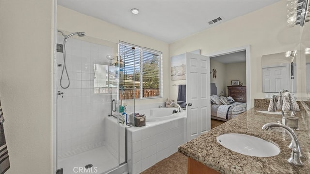 bathroom with separate shower and tub and vanity