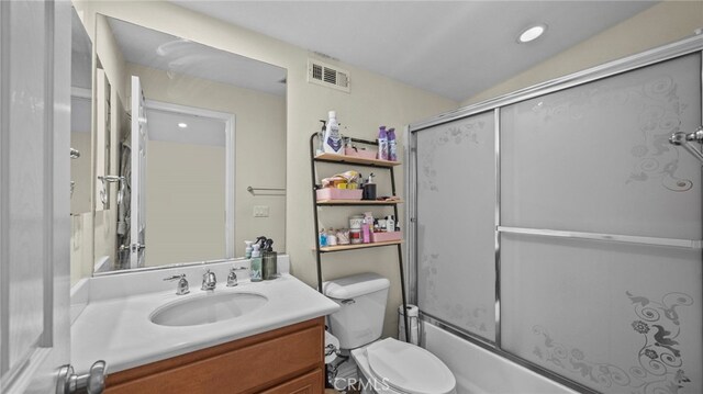 full bathroom with toilet, bath / shower combo with glass door, lofted ceiling, and vanity