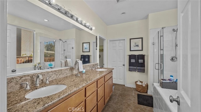 bathroom with walk in shower, vanity, and tile patterned floors