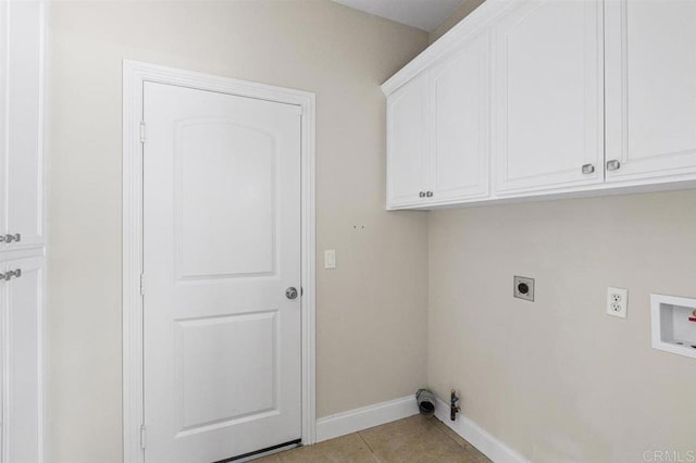 laundry room featuring cabinets, washer hookup, hookup for an electric dryer, gas dryer hookup, and light tile patterned floors