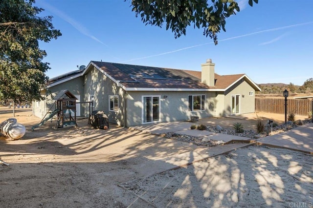 rear view of property featuring a patio