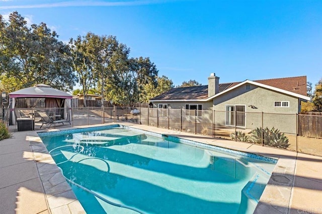 view of swimming pool featuring a gazebo and a patio