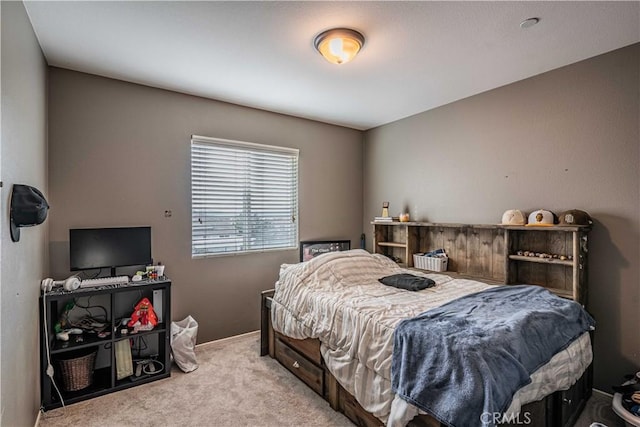 bedroom featuring light carpet