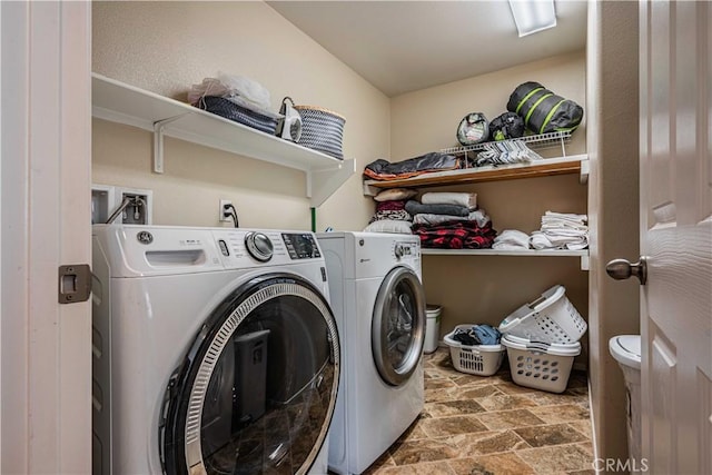 laundry area with independent washer and dryer