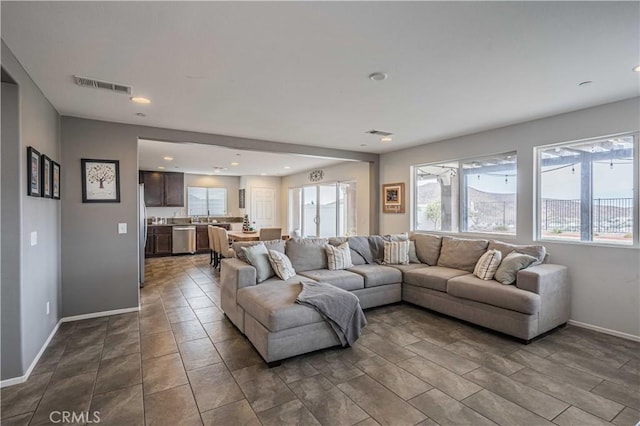 living room with light tile patterned floors