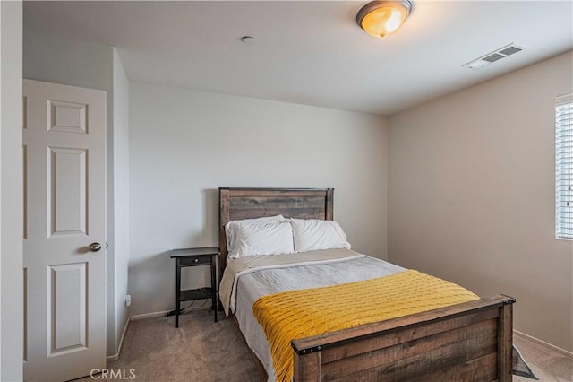 bedroom featuring light colored carpet