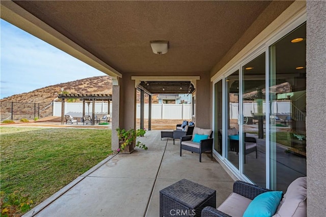 view of patio featuring an outdoor hangout area, a pergola, and a mountain view