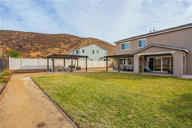 view of yard with a mountain view, a pergola, and a patio area