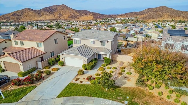 birds eye view of property featuring a mountain view