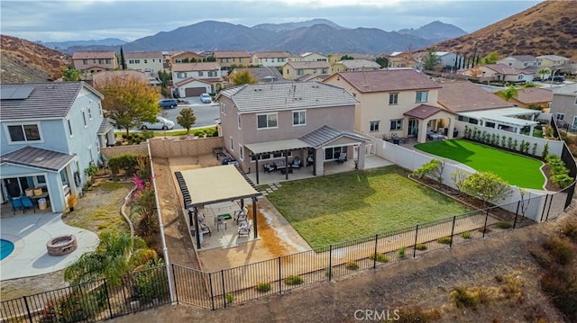 birds eye view of property with a mountain view