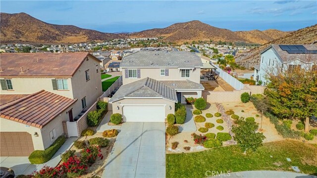 birds eye view of property featuring a mountain view