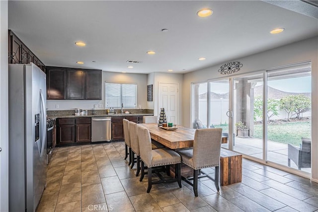 dining area featuring a mountain view and sink