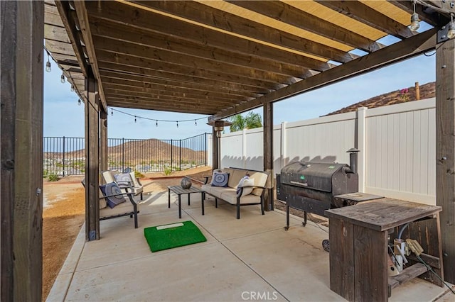 view of patio / terrace featuring a grill, an outdoor hangout area, and a pergola