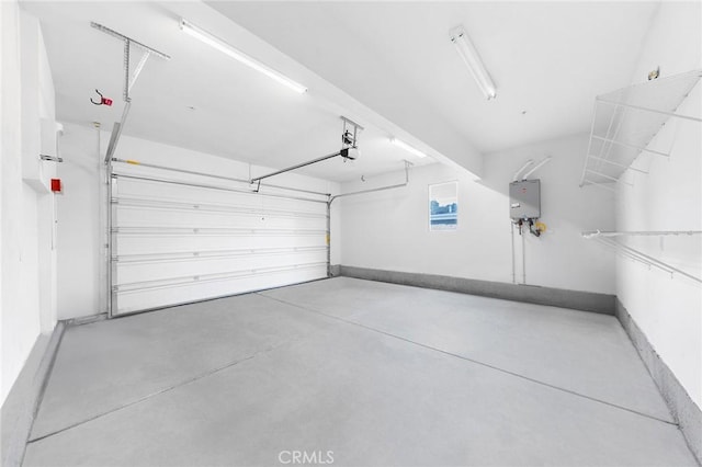 garage featuring a garage door opener and water heater