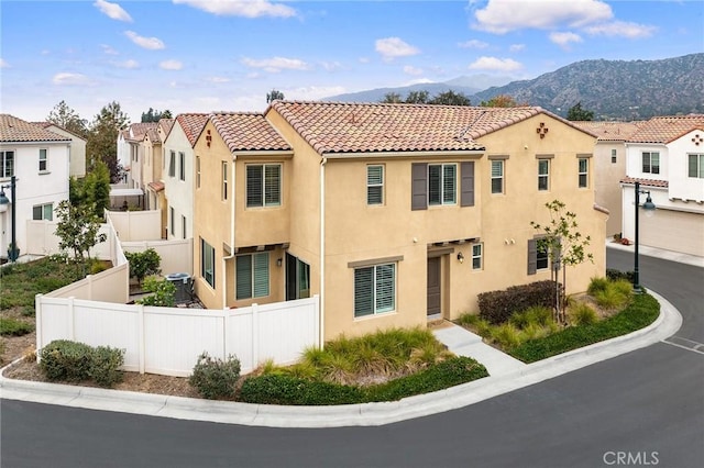 mediterranean / spanish home featuring a mountain view