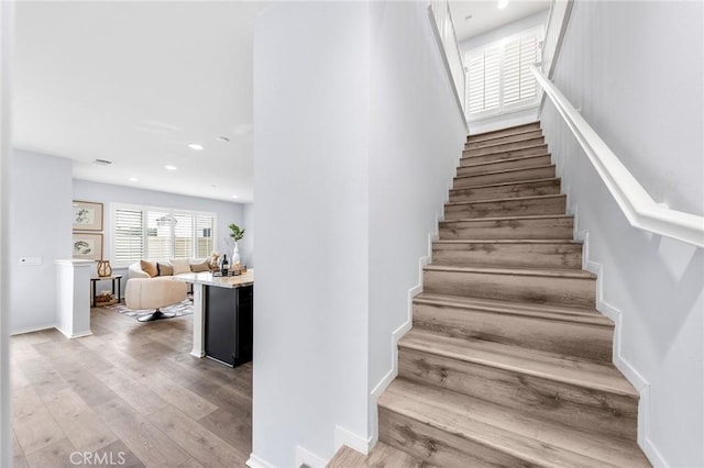 stairway with wood-type flooring