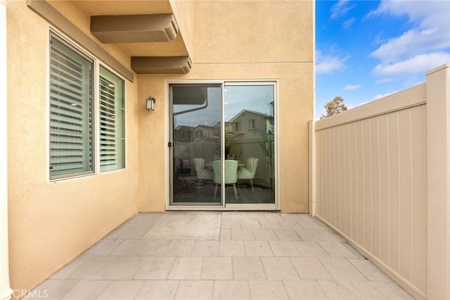 property entrance featuring a patio