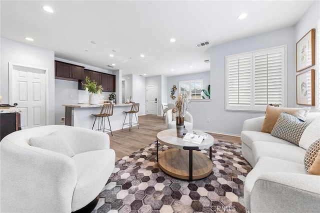 living room with light hardwood / wood-style flooring