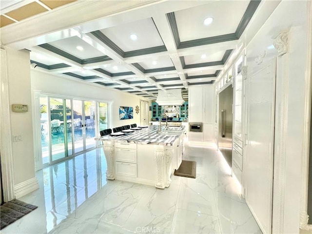 interior space featuring french doors, beamed ceiling, and coffered ceiling