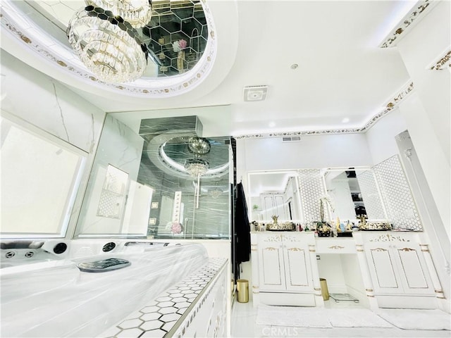 interior space with vanity and a chandelier