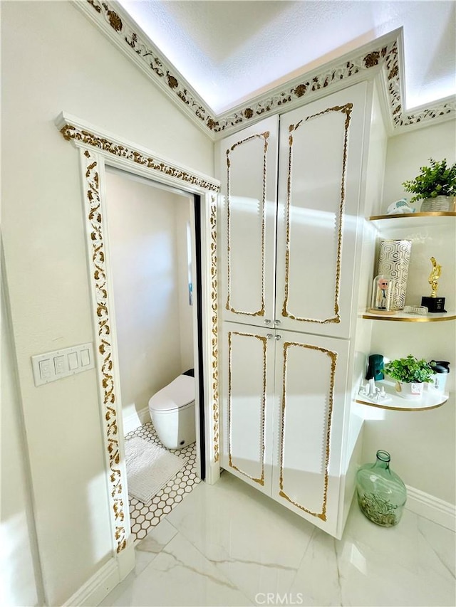 bathroom with a textured ceiling and toilet