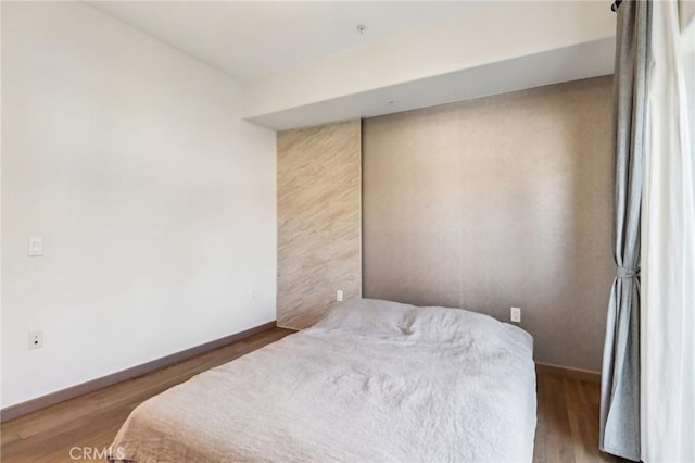 bedroom featuring hardwood / wood-style flooring