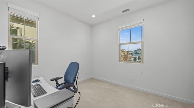 office area featuring light colored carpet