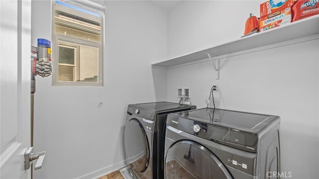 laundry area with washer and clothes dryer