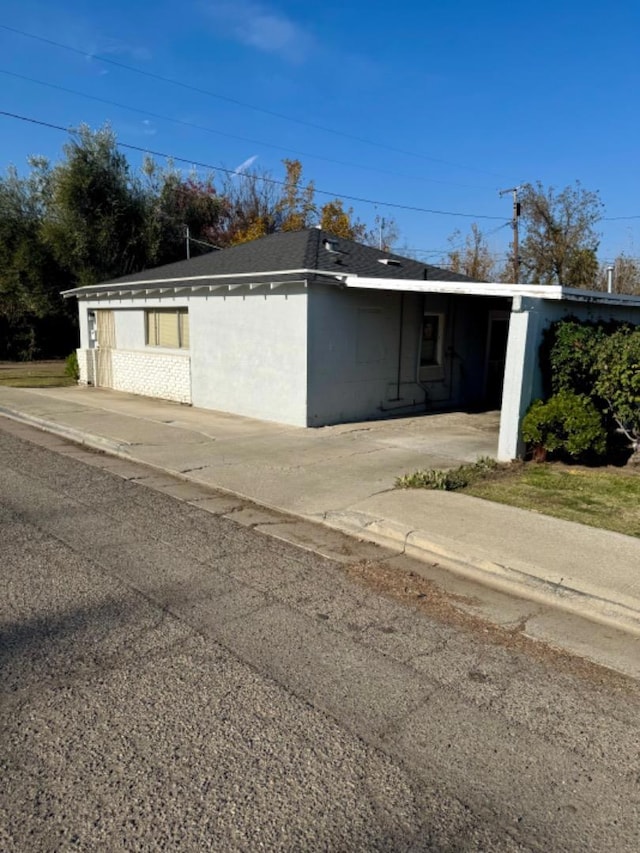 view of front of home featuring a carport