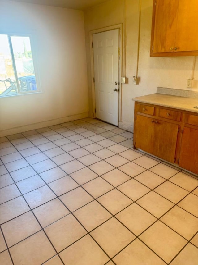 kitchen with light tile patterned floors