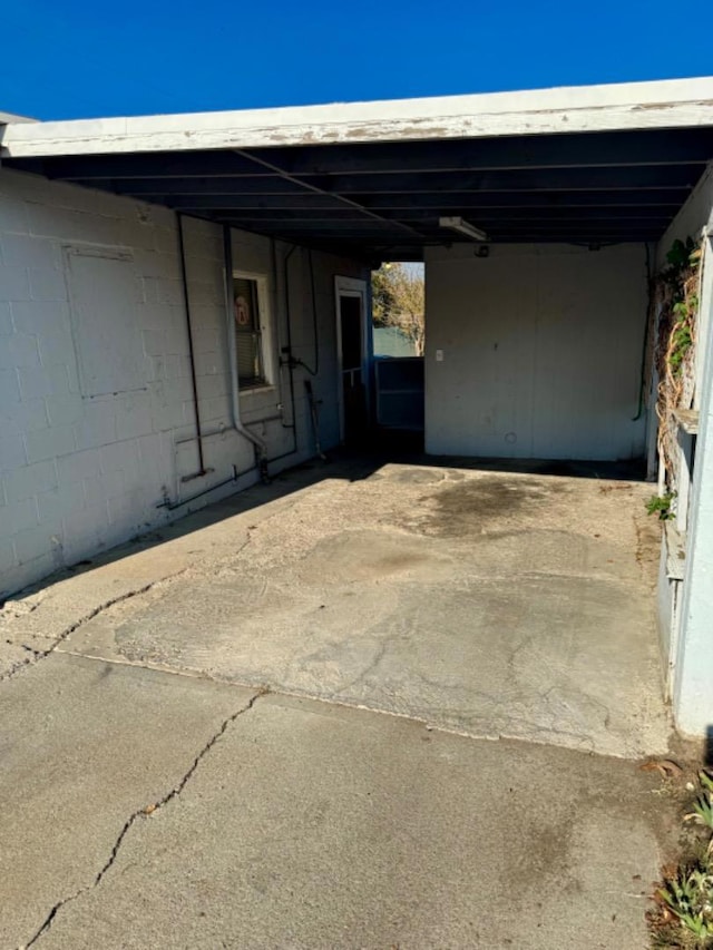 garage featuring a carport