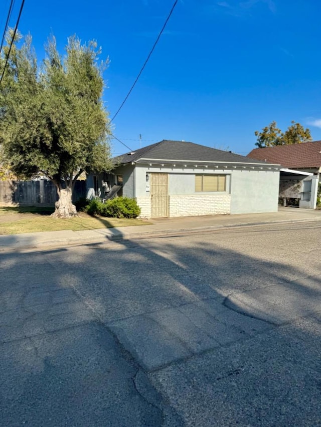 view of home's exterior featuring a carport