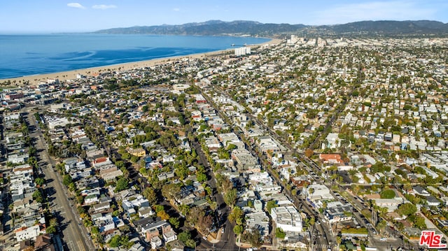 aerial view featuring a water and mountain view