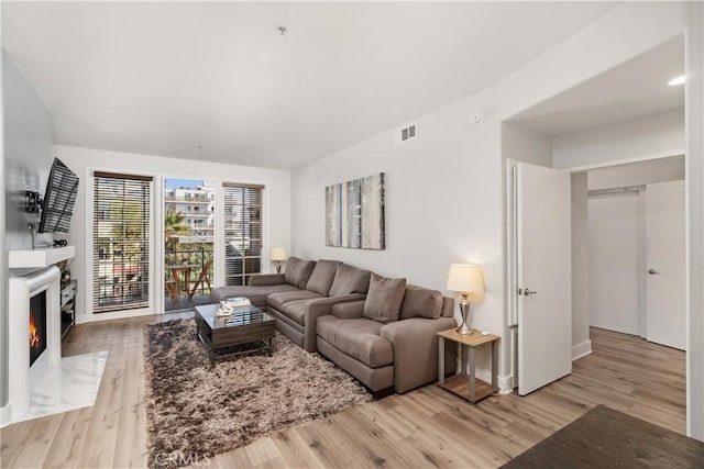 living room with light hardwood / wood-style floors