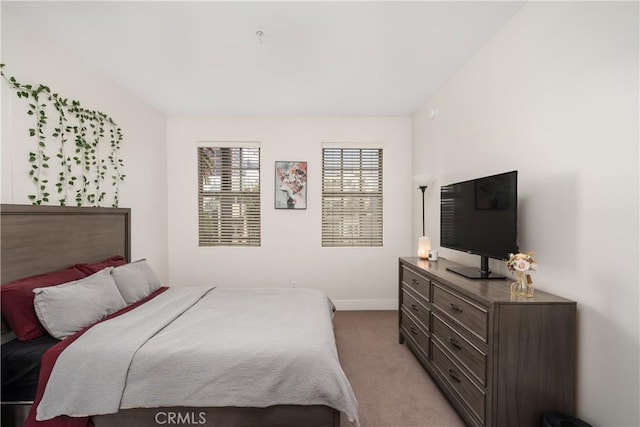 bedroom with light carpet