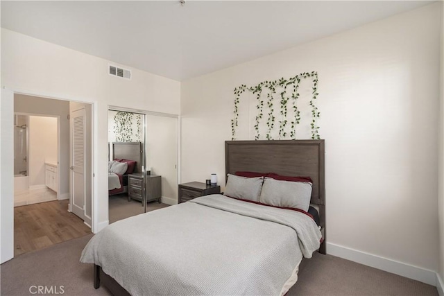 bedroom with carpet and a closet